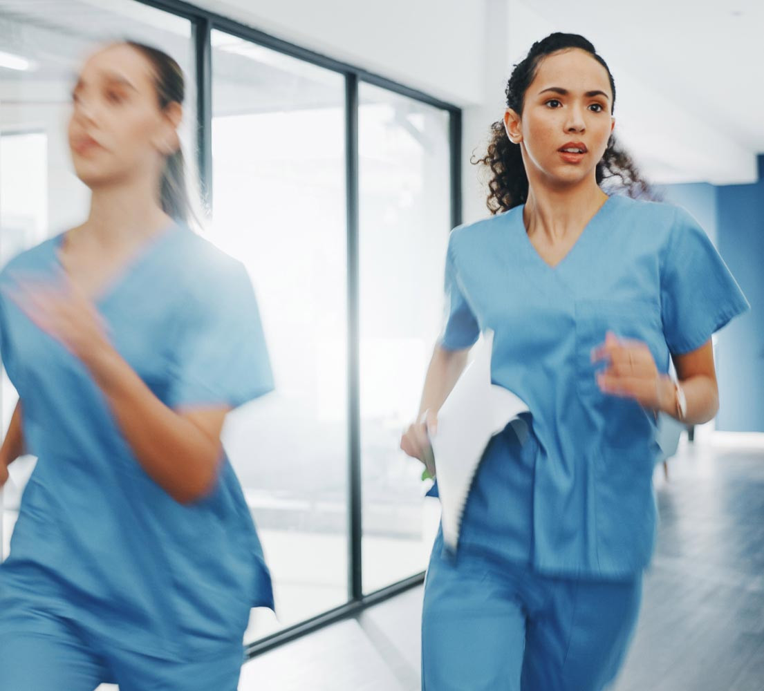 a nurse running through a hospital in an emergency situation - she looks confident and prepared